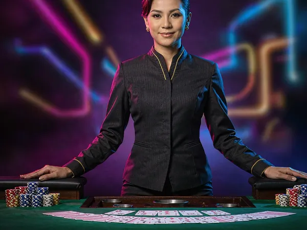 999JILI dealer behind a card table with stacks of chips