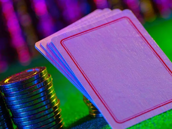 999JILI face-down playing cards beside casino chips
